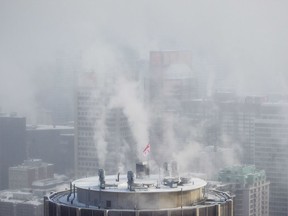 A view of the Montreal skyline from the Mount-Royal summit on a cold and smoggy day in Montreal in 2015.