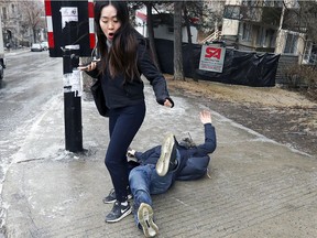 Be prepared for scenes like these on the weekend: A pedestrian steps out of the way as Xinkai Xu slides down Peel St. after losing his footing on the icy sidewalk at the corner of Dr. Penfield in Montreal Monday April 16, 2018.