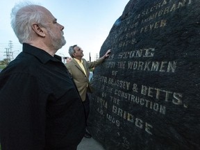 Victor Boyle and Fergus Keyes, left, at the Black Rock in Montreal, on Thursday, May 18, 2017. Boyle says the new discovery is a vindication for those have long insisted the site could be the biggest Irish gravesite outside Ireland.