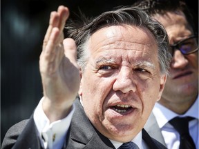 Coalition Avenir Quebec leader François Legault answers questions at a press conference in Montreal on June 20, 2018.