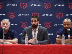 Montreal Alouettes president and CEO Patrick Boivin is flanked by assistant general manager of player personnel Joe Mack, left, and head coach Khari Jones at a news conference about the firing of general manager Kavis Reed on July 14, 2019.