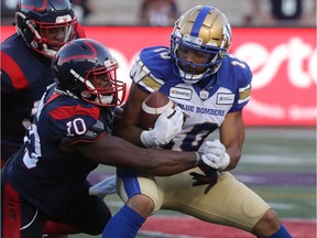 Alouettes linebacker Henoc Muamba brings down Blue Bombers's Nic Demski during September game at Molson Stadium.