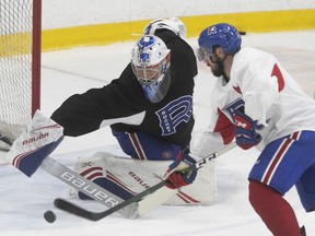 Cayden Primeau stops shot by William Pelletier during Laval Rocket practice on Sept. 25, 2019.