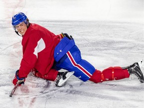 Ryan Poehling leads team stretch at the end of Laval Rocket practice at Place Bell in Laval on Oct. 2, 2019.