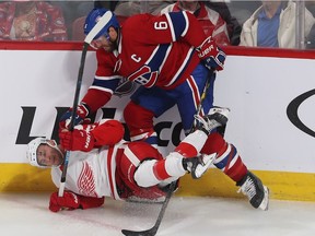 Canadiens' Shea Weber takes down Red Wings' Taro Hirose during an October game at the Bell Centre.