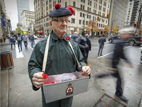 Gary Young, veteran of the Black Watch Regiment and member of Royal Canadian Legion Branch 127, Pointe St-Charles, is seen selling poppies at Peel St. and de Maisonneuve Blvd.