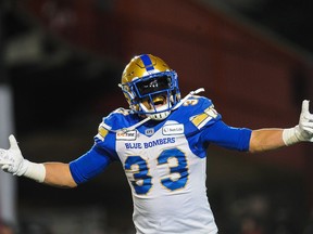 Andrew Harris of the Winnipeg Blue Bombers celebrates after scoring a touchdown against the Hamilton Tiger-Cats during the 107th Grey Cup Championship Game at McMahon Stadium on Sunday, Nov. 24, 2019, in Calgary.