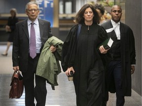 Former SNC-Lavalin executive Sami Bebawi, left, arrives at the Montreal courthouse with lawyers Annie Emond and Alexandre Bien-Aime for the start of his trial on Thursday, Oct. 31, 2019.