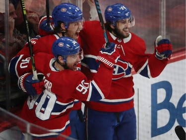 Canadiens Ben Chiarot (8) celebrates is game winning goal against the Boston Bruins with teammates Tomas Tatar (90) and Phillip Danault (24) during third period NHL action in Montreal on Tuesday November 5, 2019.