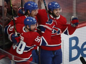 The Canadiens’ Ben Chiarot (centre) celebrates with teammates Tomas Tatar (90) and Phillip Danault after scoring the game-winning goal in 5-4 victory over the Boston Bruins in NHL action at the Bell Centre in Montreal on Nov. 5, 2019.