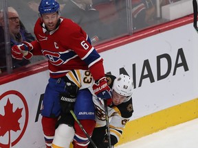 Montreal Canadiens' Shea Weber collides with Boston Bruins' Brad Marchand during second period in Montreal on Nov. 5, 2019.