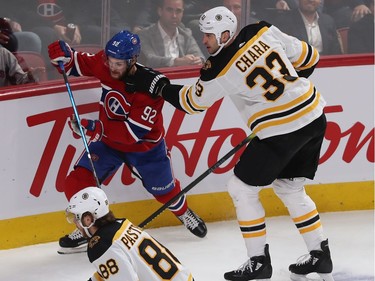 Montreal Canadiens' Jonathan Drouin (92) struggles to get away from Boston Bruins defenseman Zdeno Chara (33) during first period NHL action in Montreal on Tuesday November 5, 2019.