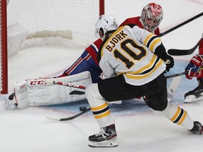 Boston Bruins Anders Bjork (10) slides puck under the pad of Montreal Canadiens goaltender Carey Price to score in second period NHL action in Montreal on Tuesday November 5, 2019.