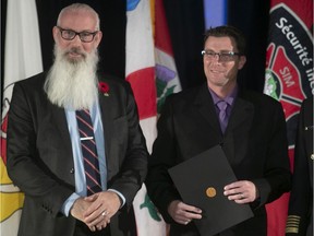 Shaun Whitterson receives commendation from the Montreal firefighters on Thursday November 7, 2019. Presenting the awards to Whitterson was Montreal city councillor Sterling Downey.