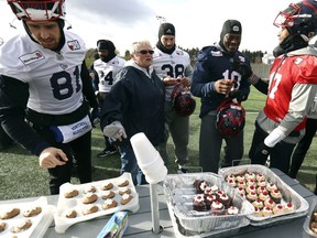 Alouettes fan Heather Lowengren laid out a spread of baked goods for the players after practice in Montreal on Friday, Nov. 8, 2019.