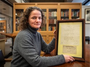 Mary Hague-Yearl, head librarian of McGIll University's Osler Library of the History of Medicine with  an original, in his hand, of the John McCrae poem In Flanders Fields  in Montreal on Monday November 4, 2019. Dave Sidaway / Montreal Gazette ORG XMIT: 63400
for schwartz story 1109 city flanders