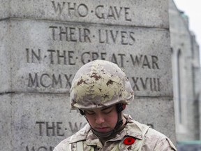 Private Wilfred-Jason Magadan serves as a sentinel during  the Remembrance Day ceremony at the Westmount Cenotaph on Sunday, Nov. 10, 2019.