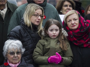Ariella Wilner watches the Remembrance Day ceremony at the Westmount Cenotaph in Montreal on Sunday, Nov. 10, 2019, with her mother, Lisa Vatch, and grandmother Evelyn Wajcer.