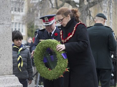 Westmount Mayor Christina Smith lays a wreath during the Remembrance Day ceremony at the Westmount Cenotaph in Montreal on Sunday, Nov. 10, 2019.
