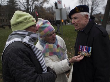 Rod Decourcy-Ireland and Gael Goodeve talk with veteran Harry Blank at the end of the Remembrance Day ceremony at the Westmount Cenotaph  in Montreal on Sunday, Nov. 10, 2019. Mr. Blank, 94, served in the New Brunswick infantry and was wounded in 1945. He was transferred to the Royal Montreal regiment after he was released from hospital