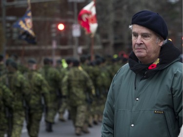 Retired Westmount councillor Patrick Martin watches a march at the end of the Remembrance Day ceremony at the Westmount Cenotaph in Montreal on Sunday, Nov. 10, 2019.