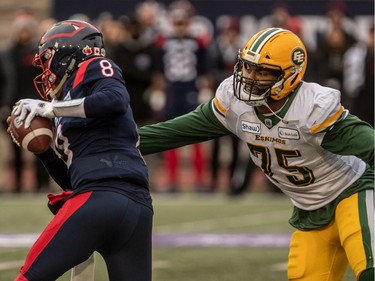 Alouettes quarterback Vernon Adams Jr. evades the grasp of Edmonton Eskimos defensive lineman Nick Usher in Montreal on Sunday, Nov. 10, 2019.