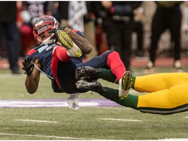 Montreal Alouettes wide receiver Quan Bray (4) is tripped up by Edmonton Eskimos safety Jordan Hoover (28) during 1st half CFL Eastern Semi-Final action at Molson Stadium in Montreal on Sunday November 10, 2019. Dave Sidaway / Montreal Gazette ORG XMIT: 63426