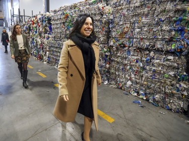 Mayor Valérie Plante walks past bales of recycled materials at inauguration of Montreal's new recycling plant in Lachine, Nov. 12, 2019.