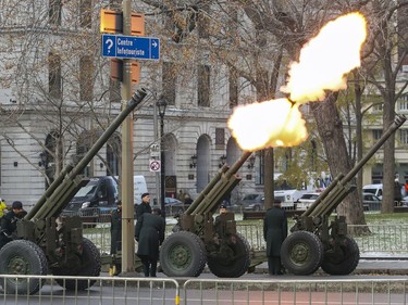 Soldiers fire 105mm Howitzers during a 21-gun salute at Remembrance Day ceremony at Place du Canada in Montreal on Monday, Nov. 11, 2019.