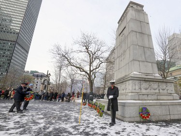 Seaman Albert Le of HMCS Donnacona stands guard at the cenotaph during Remembrance Day ceremony at Place du Canada in Montreal on Monday, Nov. 11, 2019.