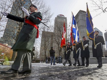 The colour guard files past the cenotaph following Remembrance Day ceremony at Place du Canada in Montreal on Monday, Nov. 11, 2019.