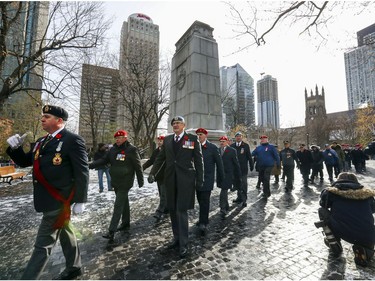 Veterans file past the cenotaph at the end of Remembrance Day ceremony at Place du Canada in Montreal on Monday, Nov. 11, 2019.