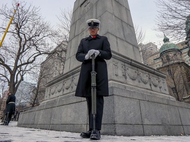 Seaman Albert Le stands guard at the cenotaph during Remembrance Day ceremony at Place du Canada in Montreal on Monday, Nov. 11, 2019.