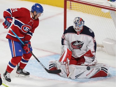 Montreal Canadiens Nick Cousins (21) tries to put puck past Columbus Blue Jackets goaltender Elvis Merzlikins during second period NHL action in Montreal on Tuesday November 12, 2019.