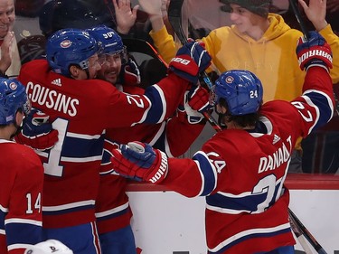 Montreal Canadiens Tomas Tatar (90) celebrates his goal  with teammates Nick Suzuki (14), Nick Cousins (21) and Phillip Danault (24) against the Columbus Blue Jackets during third period NHL action in Montreal on Tuesday November 12, 2019.