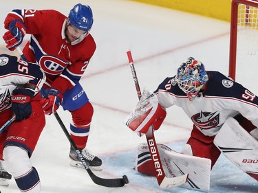 Montreal Canadiens Nick Cousins (21) gets in close on Columbus Blue Jackets goaltender Elvis Merzlikins during second period NHL action in Montreal on Tuesday November 12, 2019.
