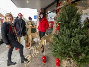 Designer Tammy Skjenna, Dwayne Baker and Boutique owner Jenn Pragai (left to right) are working to transform the Ste-Anne-de-Bellevue commercial strip into a winter storybook-land with holiday lights, decorations, window paintings and Christmas trees. The Ste-Anne en lumière project is designed to draw people to the town in the dead of winter.