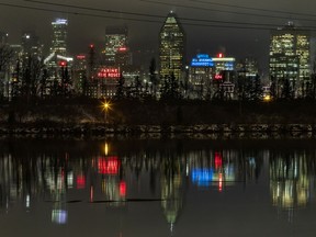 Montreal skyline is reflected in the water of the St. Lawrence Seaway, seen at night from Brossard, south of Montreal Tuesday November 19, 2019. (John Mahoney / MONTREAL GAZETTE) ORG XMIT: 63514 - 9339