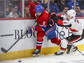 Montreal Canadiens' Ben Chiarot is checked by Ottawa Senators' Brady Tkachuk during second period in Montreal on Nov. 20, 2019.