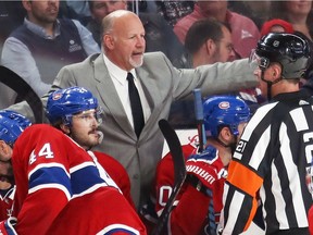 Canadiens coach Claude Julien discusses a penalty call with referee TJ Luxmore during third period of NHL        game at the Bell Centre in Montreal against the Ottawa Senators on Nov. 20, 2019.