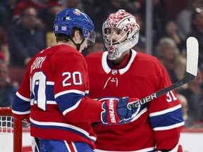 Montreal Canadiens Carey Price has a chat with rookie defenceman Cale Fleury during second period against the Ottawa Senators in Montreal on Nov. 20, 2019.