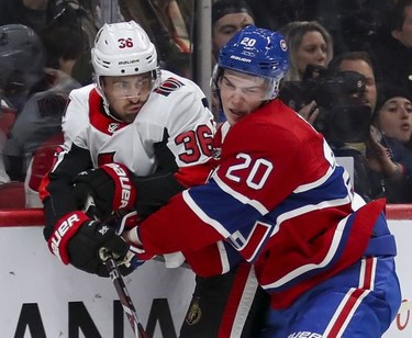 Montreal Canadiens Cale Fleury, right, checks Ottawa Senators Colin White behind the net during second period of National Hockey League game in Montreal Wednesday November 20, 2019.