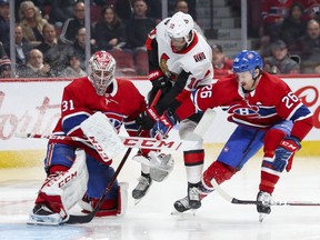 Canadiens goalie Carey Price uses his skate to stop a shot by Senators' Antony Duclair with the help of defenceman Jeff Petry during second period Wednesday night at the Bell Centre.