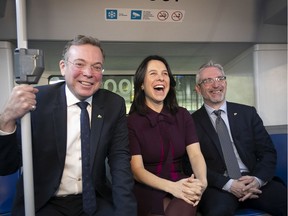 Montreal mayor Valerie Plante with Societe de transport de Montreal chairman Philippe Schnobb, left, and STM director general Luc Tremblay, inside a new hybrid bus on Thursday November 21, 2019 following the STM 2020 budget announcement.  (Pierre Obendrauf / MONTREAL GAZETTE) ORG XMIT: 63530 - 3879