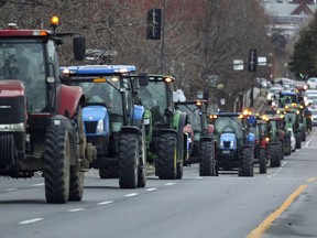 A convoy of tractors driven by farmers from south of the city drove to Canadian National headquarters in Montreal Nov. 22, 2019, to emphasize the difficulty a propane shortage caused by a strike by CN workers could be for the agricultural sector.