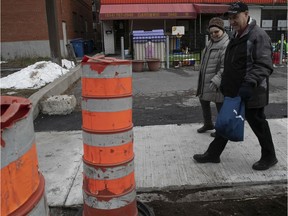 Verdun residents Huguette Tremblay and Jean-Guy Tessier walk along Wellington still covered in construction cones. The talk about the latest Montreal city budget that was unveiled on Monday November 25, 2019.