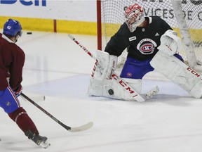 Montreal Canadiens head coach Claude Julien (right) speaks with associate coach Kirk Muller during practice at the Bell Sports Complex in Brossard on Nov. 27, 2019.