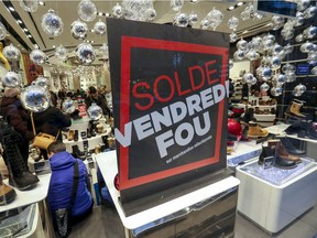 Shoppers look for Black Friday deals at the Brown's shoe store on Ste-Catherine St. in Montreal on Thursday Nov. 28, 2019.