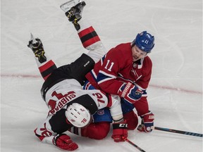 Montreal Canadiens right wing Brendan Gallagher and New Jersey Devils defenceman P.K. Subban tangle in the faceoff circle at the Bell Centre in Montreal on Nov. 28, 2019.