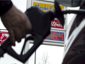 A driver pumps gas at a station in Montreal.